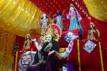 Wall Mural - A beautiful idol of Maa Durga being worshipped at a pandal during Navratri. Navratri is biggest religious festival of Hinduism