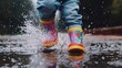 © Kitta Studio - A child splashes joyfully in puddles wearing colorful rain boots during a rainy day, capturing the essence of playful outdoor fun.