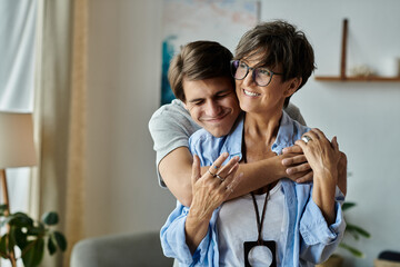 a mother and son share laughter and affection while enjoying quality time together at home.