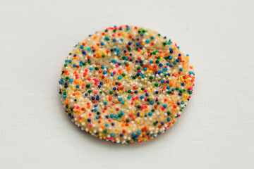 Sprinkle Candy Covered Sugar Cookie on white background