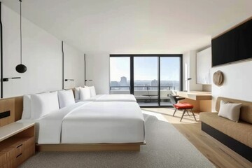 Modern hotel room with large windows, minimalist design, and comfortable twin beds