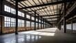 © Nima - Renovated industrial interior with an open layout, steel columns, and large windows. Ideal for showcasing factory conversions, modern architecture, and urban redevelopment themes.