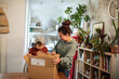 © Davor - Mother and son unboxing delivery package at home