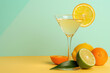 © Igor - Cocktail with citrus fruits around elegant glass over pastel background.