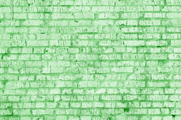 old shabby wall of green brick color as  abstract background in loft style