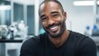 © Oksana Smyshliaeva - Confident African American Man with Bright Smile in Modern Setting