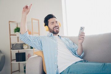 Poster - Photo of handsome bearded alone mature age adult man staying home in his new house point finger up when hear his retro playlist headphones