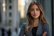 © Divyesh - Serious career motivated successful female business professional standing proud and confident near downtown financial buildings, Generative AI