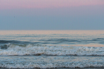 Avalon, New Jersey - Atlantic Ocean waves breaking onto the waters edge of this jersey shore beach at blue hour 