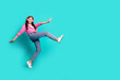 © deagreez - Full size photo of attractive teen woman headphones dancing have fun step dressed stylish pink clothes cyan on blue color background