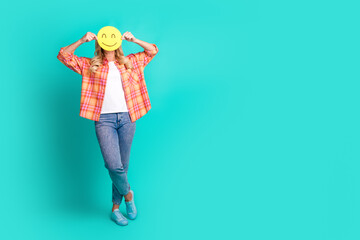 Wall Mural - Full length photo of lovely mature lady cover hide face smile paper emoji dressed stylish plaid garment isolated on cyan color background