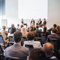 Wall Mural - Interview and round table discussion at business convention and presentation. Audience at the conference hall. Business and entrepreneurship symposium.