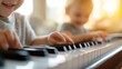 © Pinklife - Two young children joyfully play the piano, their small fingers pressing keys in harmony as soft sunlight streams in, capturing the essence of childhood music exploration.