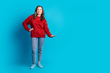 Wall Mural - Full body portrait of nice aged woman show measure empty space wear sweater isolated on blue color background