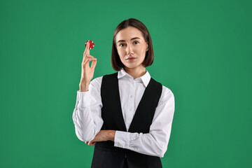 Wall Mural - Croupier with casino chip on green background