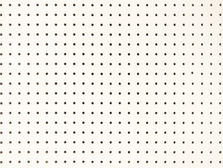 Background of white peg board with holes