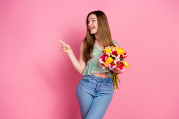 Canvas Print - Photo of nice young girl point finger empty space fresh flowers wear top isolated on pink color background