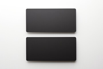 Wall Mural - top view of two black blank business cards on a white background, ideal for design mockups and brand