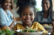 © Pooja - Portrait of African-American family enjoying dinner together in minimal home interior, focus on grandmother serving food to cute little girl, copy, Generative AI