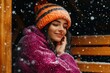 © Konstiantyn Zapylaie - Cozy winter vibes: woman in warm knitwear enjoys snowy evening