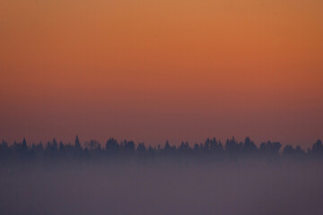 SEATTLE, WASH., U.S. - NOV. 28, 2013: Evening fog makes for a muted but beautiful orange and purple sunset over Beacon Hill in Seattle, Wash., on Nov. 28, 2013.