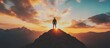 © Ari - Silhouette of a Man Standing on a Mountain Peak at Sunset