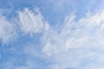 Wall Mural - beautiful blue sky and white fluffy group of clouds with sunrise in the morning, natural background
