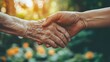 © KHF - A young hand holding an elderly hand, symbolizing family support and care for the elderly