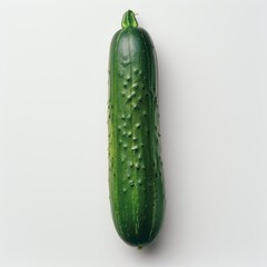 Wall Mural - a large green cucumber on a white surface