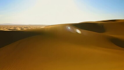 Wall Mural - Expansive desert with golden rippling sands under the intense sun and clear sky