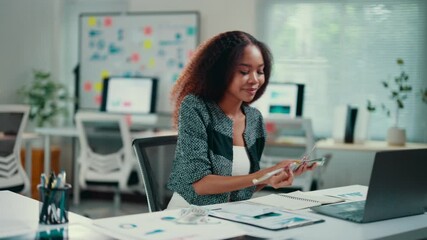 Poster - african american entrepreneur analyzes her finances, counting money and taking notes. she is working