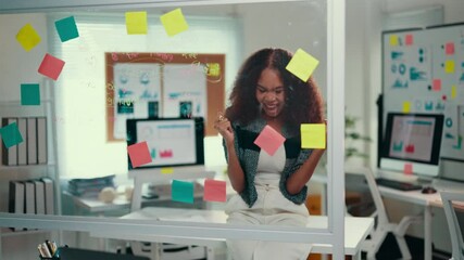 Aufkleber - Enthusiasm radiates from a young african american project manager celebrating a significant milestone. Joyful moments filled with sticky notes highlight the achievement and success