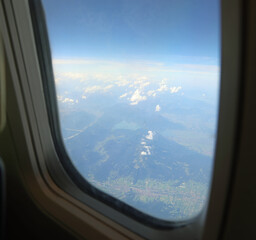 airplane window view from above while flying