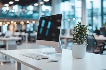 Poster - Minimalist white desk with a computer and office background, blurred business center interior in the blurred background. Mockup for design or presentation