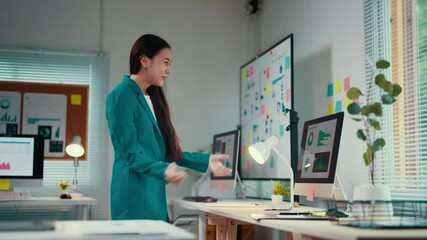 Aufkleber - Celebration of a significant achievement fills the office as a young professional woman expresses her excitement and happiness while working late at her desktop computer