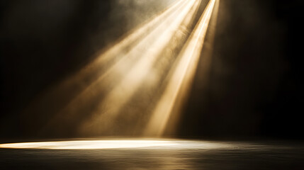 Golden spotlight illuminating a dark stage soft beams