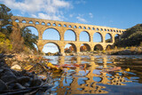 The Pont du Gard, ancient roman aqueduct bridge, photographed from the river in Provence, France