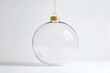 © Dimas - Transparent Christmas Ornament:  A clear glass Christmas ornament with a gold top, perfect for showcasing your own festive decorations. Capture the essence of the holiday season with this elegant.