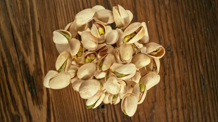 Poster - Super Slow Motion of Flying Pistachio Nuts over Wooden Planks. Camera Tracking the Target. Filmed on High Speed Cinema Camera, 1000fps.