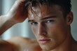 © Ananya - Young shirtless guy looks in mirror touch hair feels concerned due to receding, dry, dull hair. Hair loss common hair problem prevention, alopecia treatment ad, cosmetics products for male