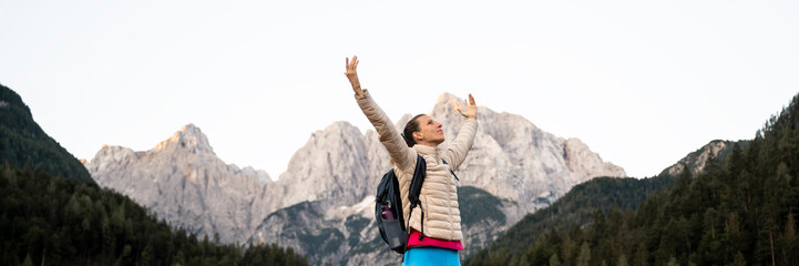 joyful female hiker embracing nature