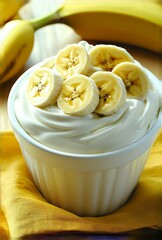 Canvas Print - Close-up of banana slices on a creamy dessert.