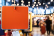 © PrusarooYakk - Blank orange sign in busy marketplace