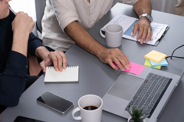 Group of diverse office worker employee take note and brainstorming on strategic business marketing planning with sticky note in office workspace. Positive and productive teamwork in workplace.Prudent