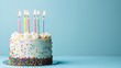 © ADD PHOTO - Festive Birthday Cake with Colorful Candles and Sprinkles on Teal Background