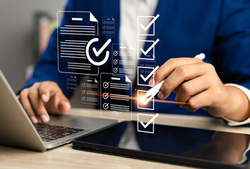 Business performance monitoring and evaluation concept, Take an assessment, Business man using laptop and tablet online checklist survey, Filling out digital checklist, Questionnaire with checkboxes.