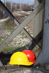 Wall Mural -  yellow and red helmets on a work site