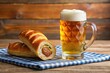 © Chanchai - Bavarian speciality sausage roll with a beer