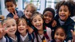 © BackgroundHolic - Happy group of diverse school children smiling for a group selfie in a colorful classroom setting