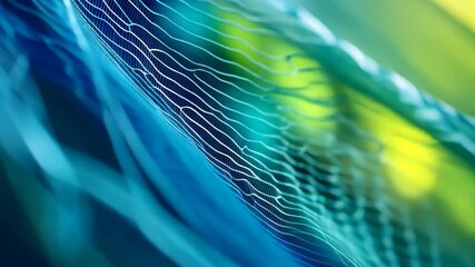 A close-up of a blue and green net with a blurry background